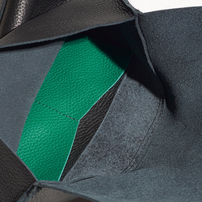 inside of black wallet handmade in portland maine with green inside