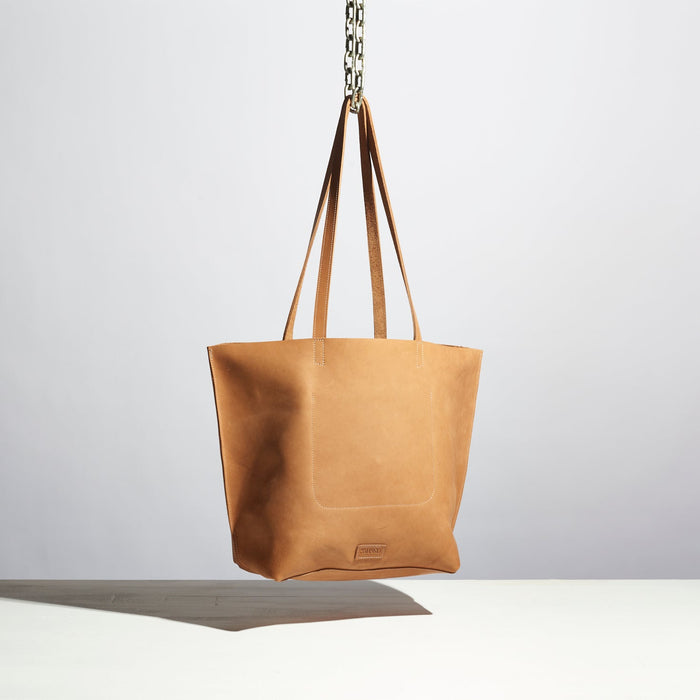 tan leather purse with medium length straps made by hand in portland maine