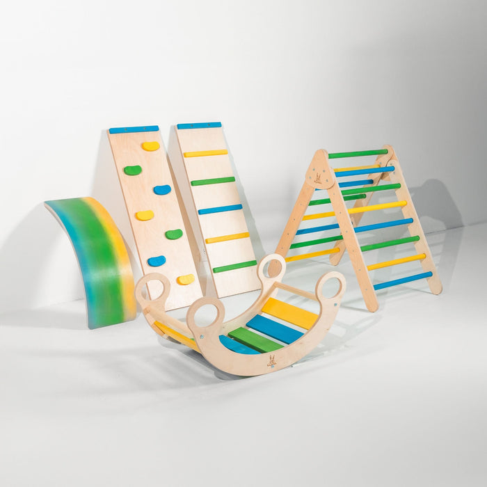 Child using a rocker climber arch indoors