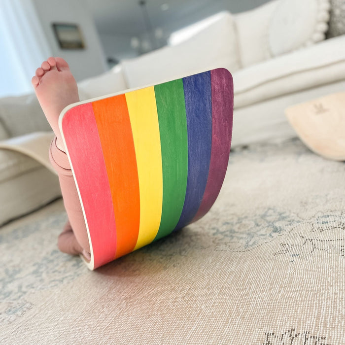 Child using a wobble board for play