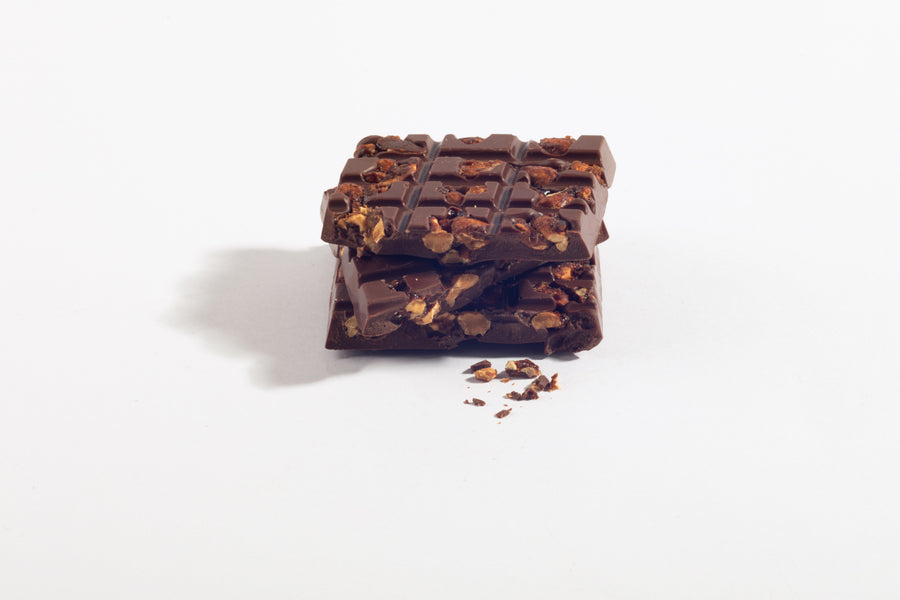 Stacked pieces of Peanut Praline Milk Chocolate Bar