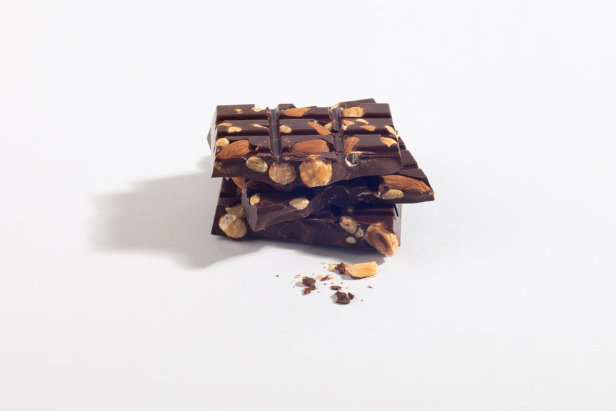 Stacked pieces of Triple Nut Dark Chocolate Bar