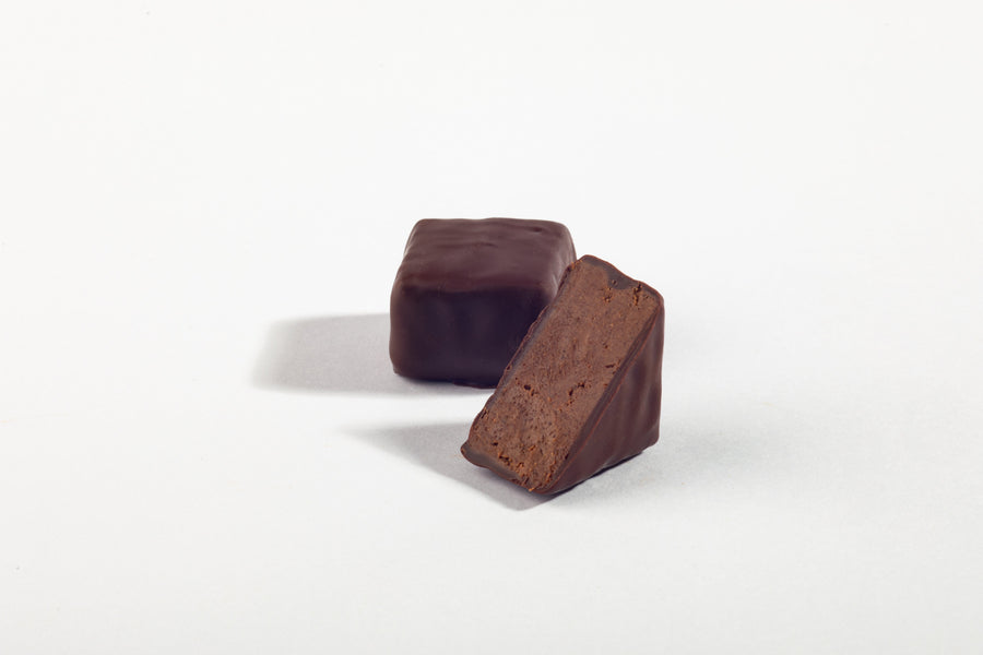 Gianduja chocolate block cut to show its hazelnut praline center