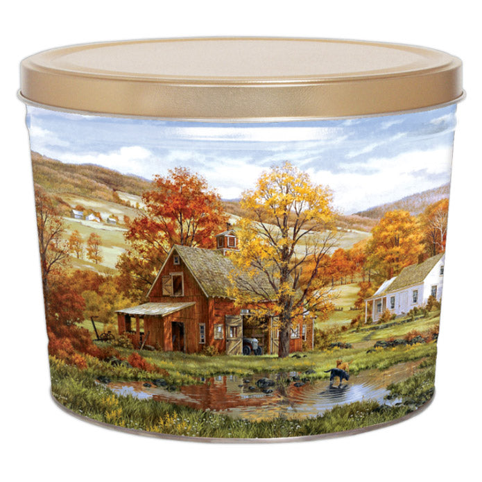 Popcorn tin with an autumn landscape and gold-colored lid