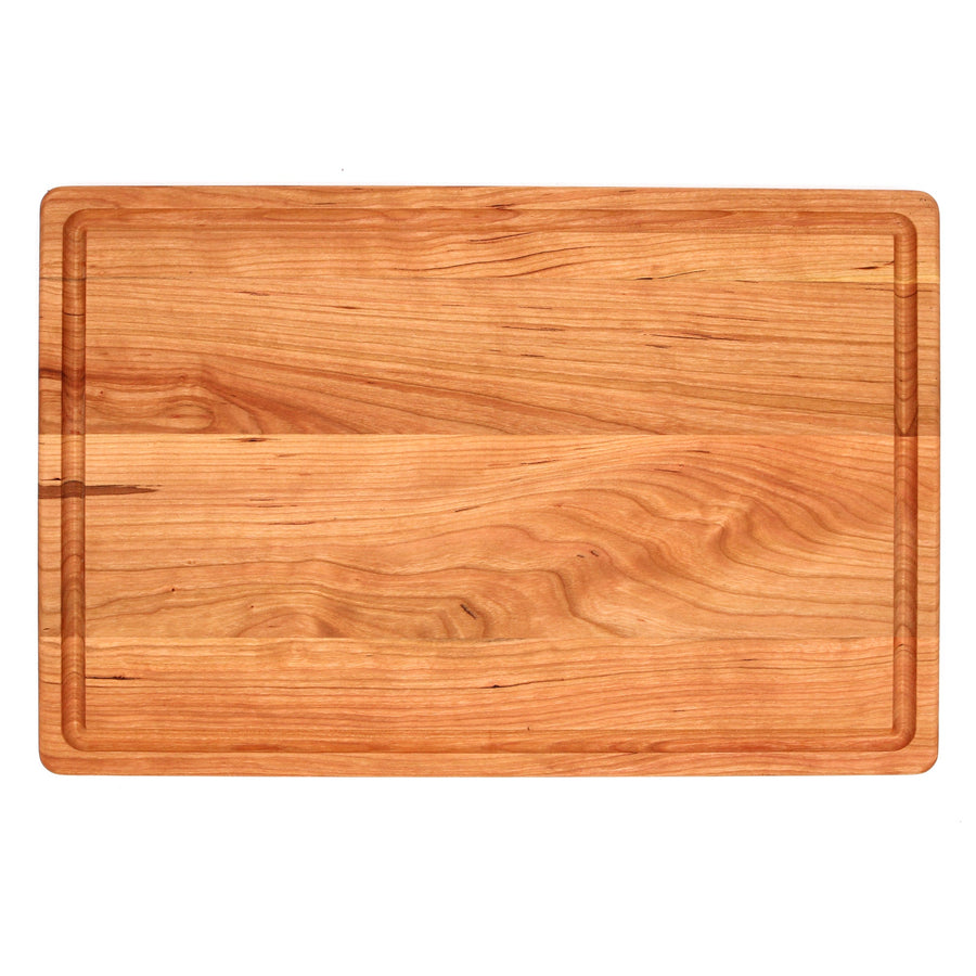 Overhead view of a cherry cutting board with a perimeter groove