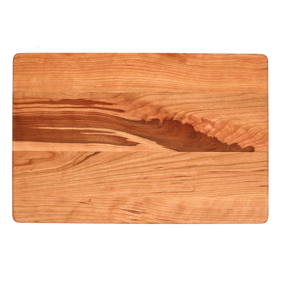 Cherry cutting board showing its plain reverse surface