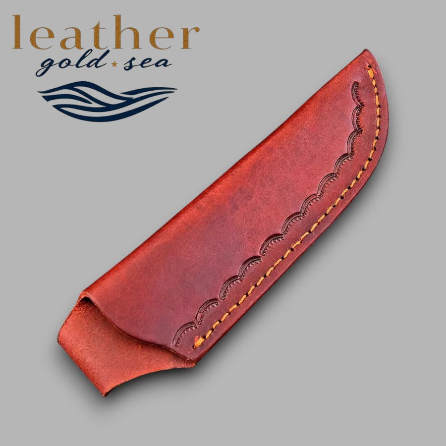 Plain curved face of brown leather knife sheath
