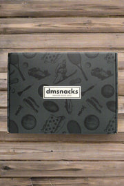 Vintage-themed Bar Cart Snacks case with nostalgic designs against a wooden background.