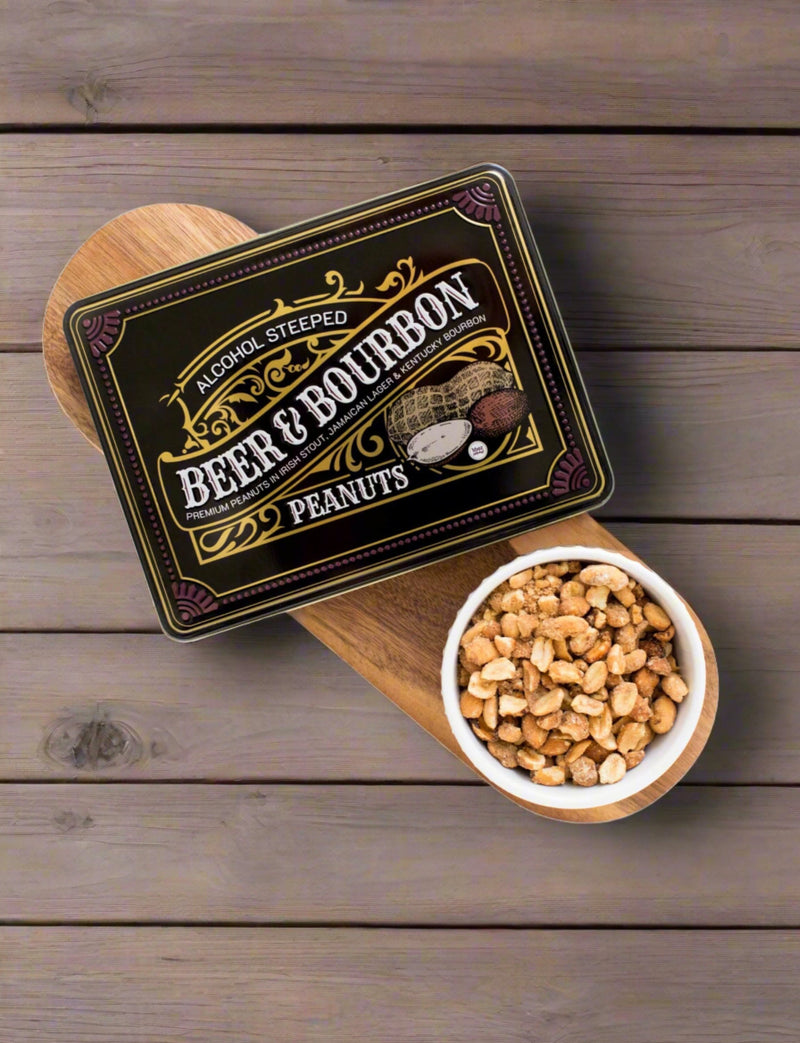 Tin of Beer and Bourbon Liquor Peanuts with a bowl of savory nuts on a wooden background