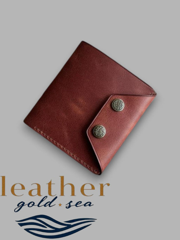 Brown cowhide wallet with double-snap flap closed