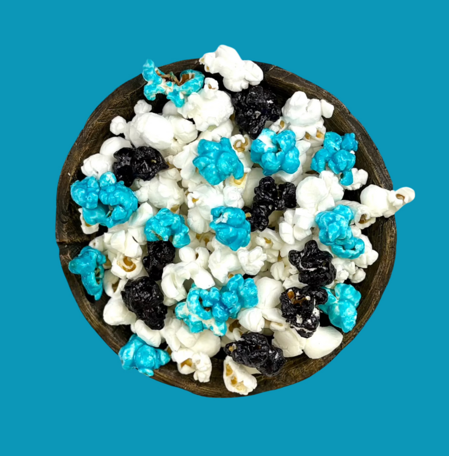 Bowl of aqua & black candy-coated and white salted popcorn