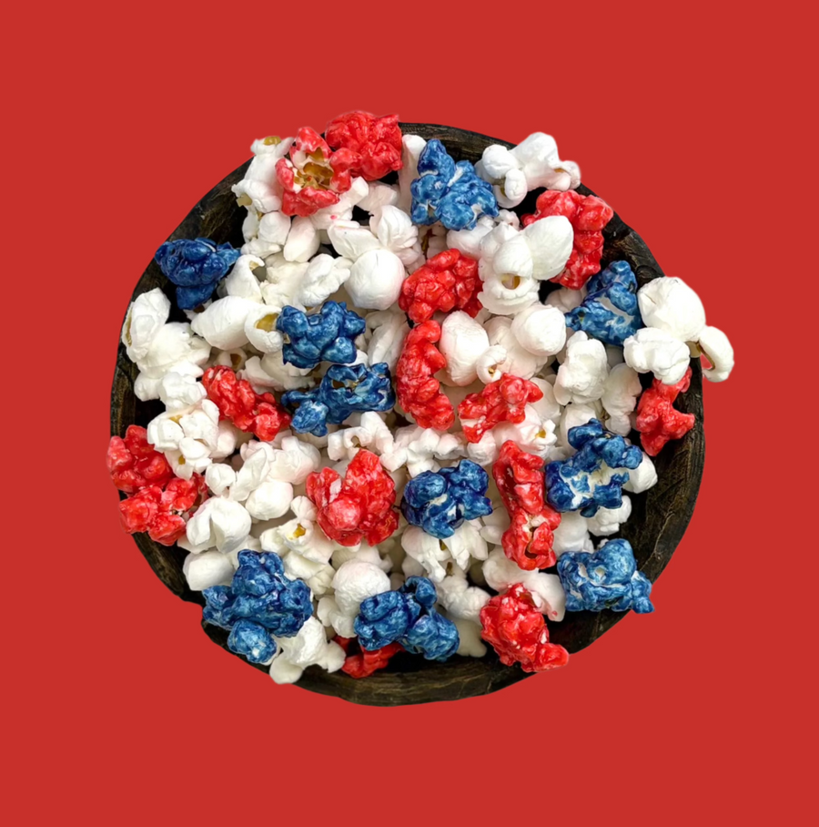 Bowl of red & blue candy-coated and white salted popcorn