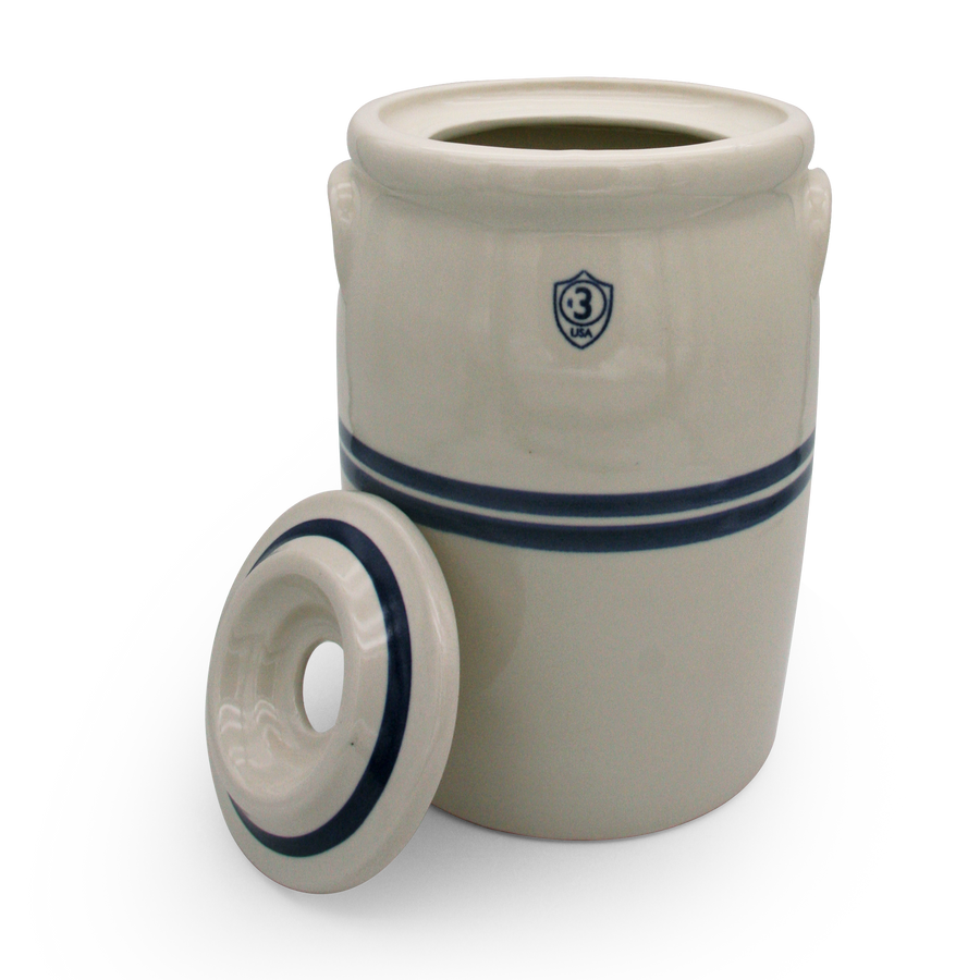Three-gallon blue-striped stoneware churn with its separate ceramic lid
