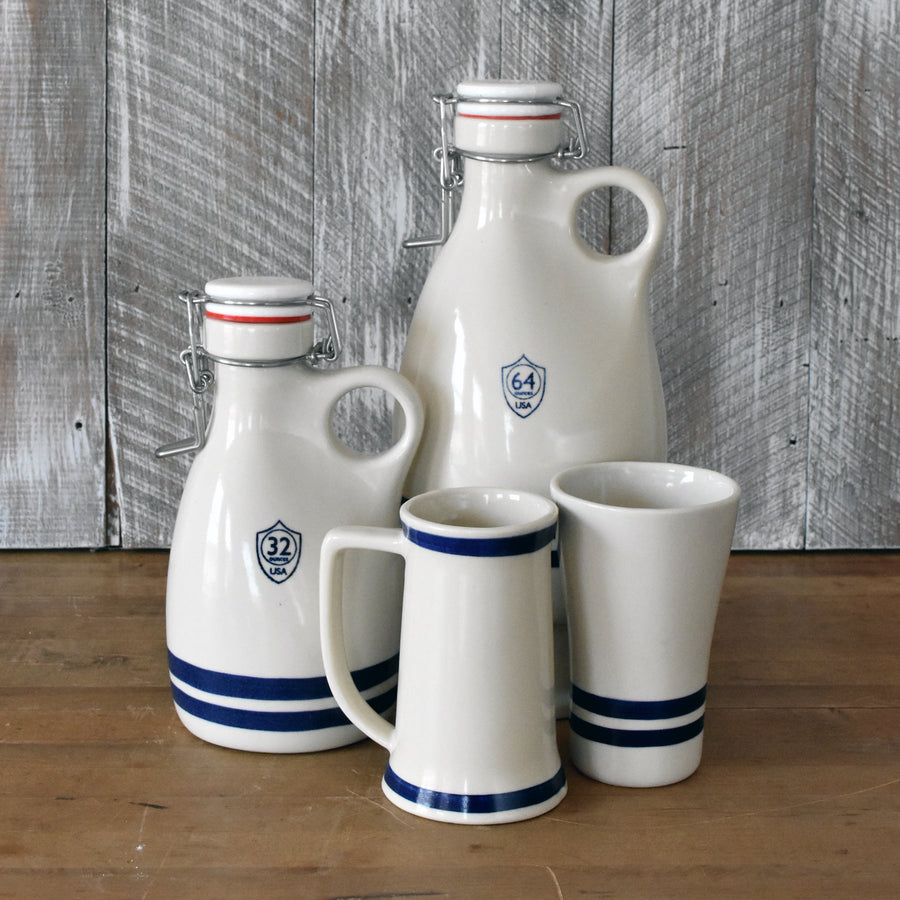 Blue-striped stoneware bottles, stein and tumbler displayed together; listing supplies one drinking vessel