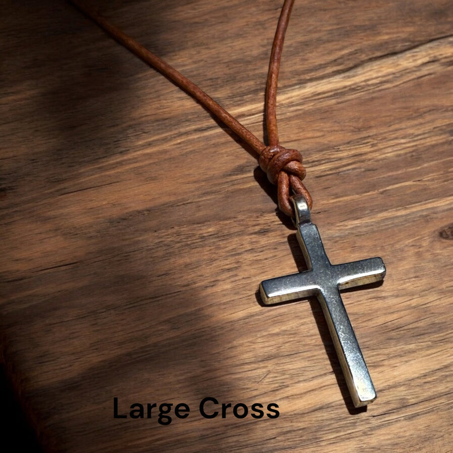 Large Classic Cross pendant against a wooden background