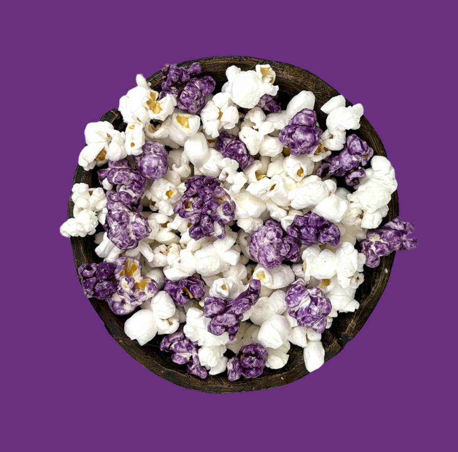Bowl of purple candy-coated and white salted popcorn