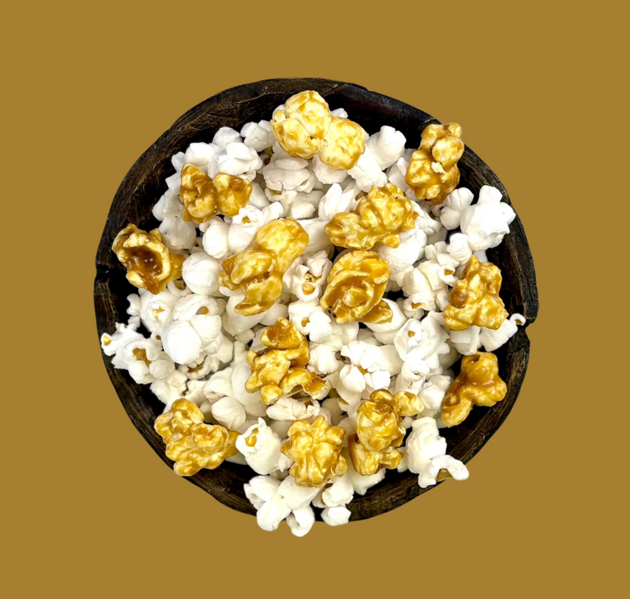 Bowl of gold candy-coated and white salted popcorn