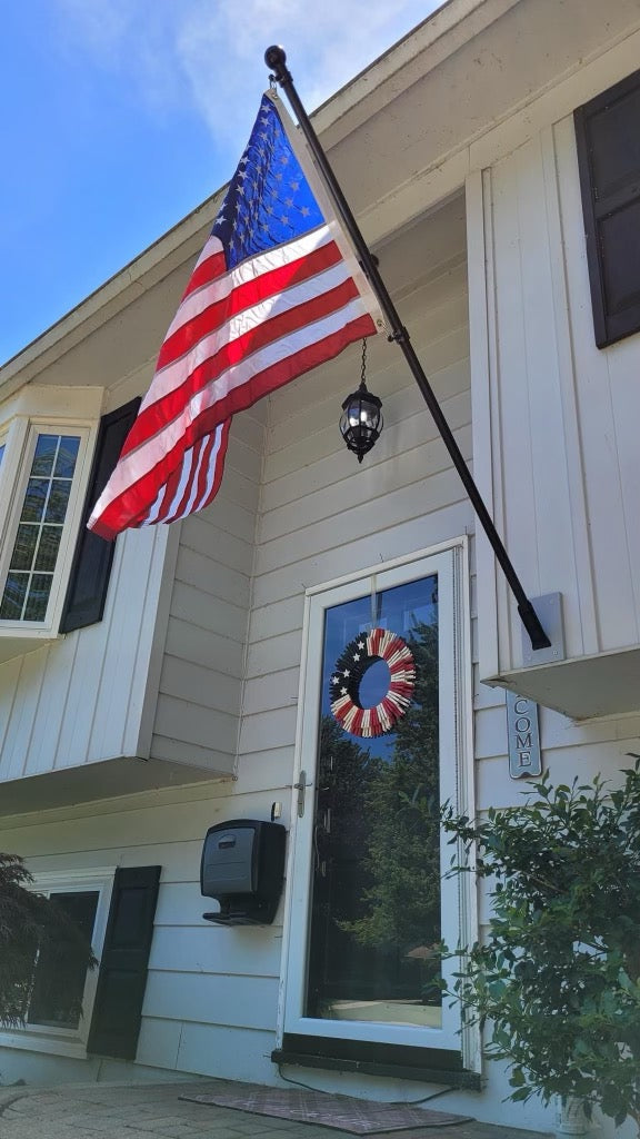 6-foot black aluminum house-mounted flagpole kit with 2.5x4 American flag and steel mounting bracket