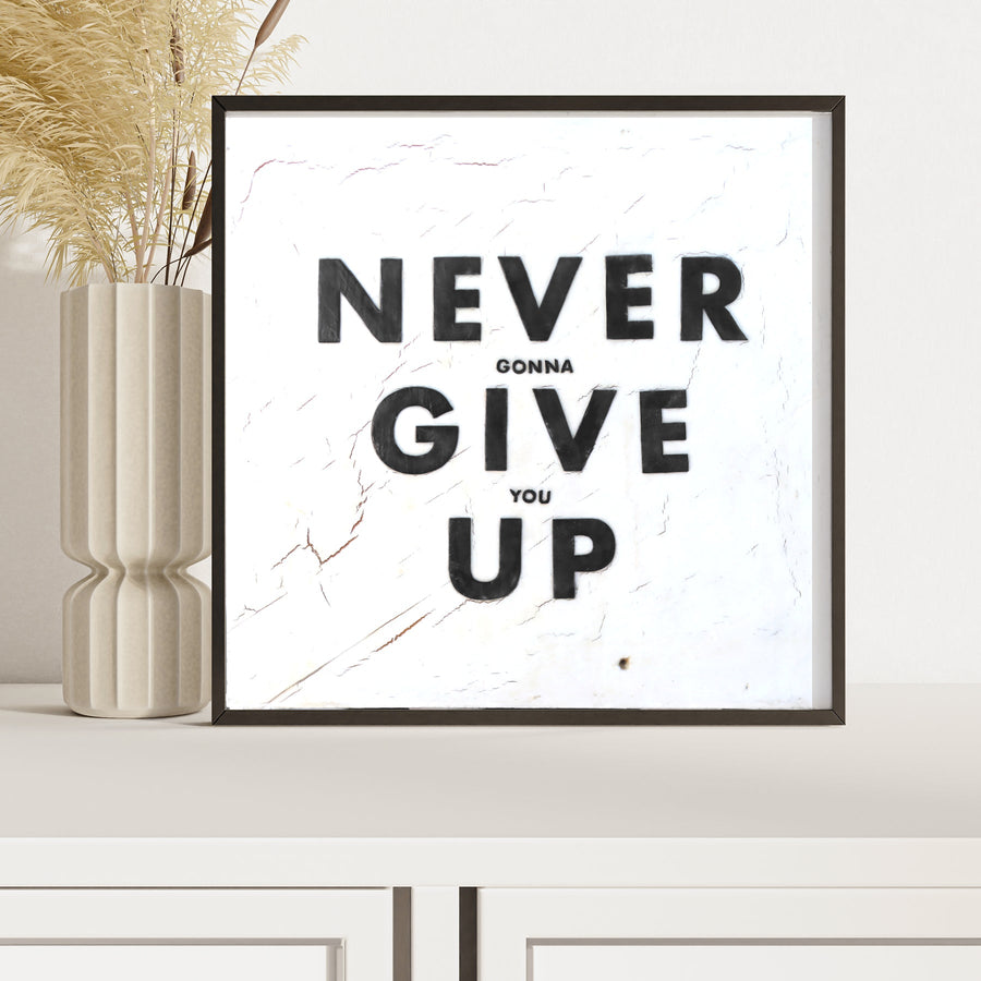 Never Give Up art print with bold distressed black lettering.