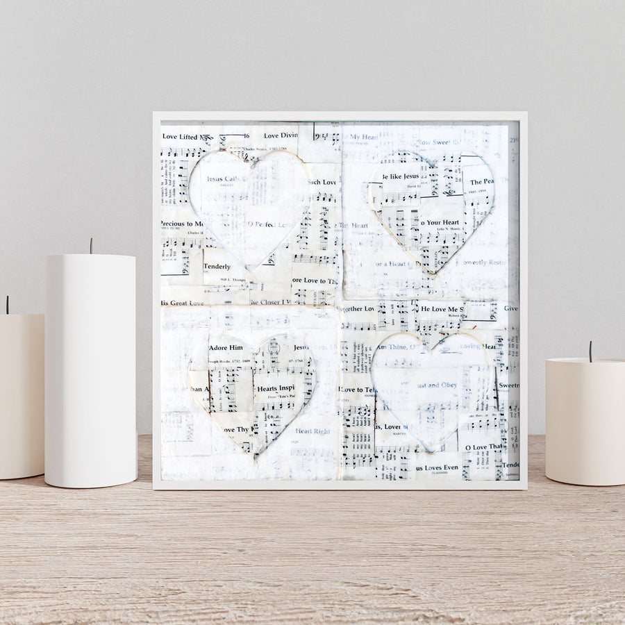 Love Hymns art print with four hearts and vintage sheet-music imagery.