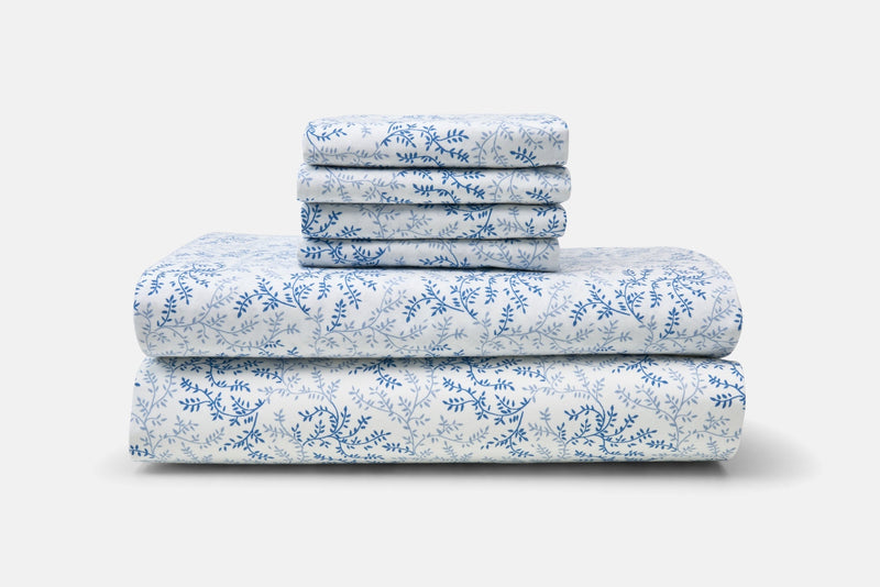 Folded coordinating Southern Vines printed sheets and pillowcases