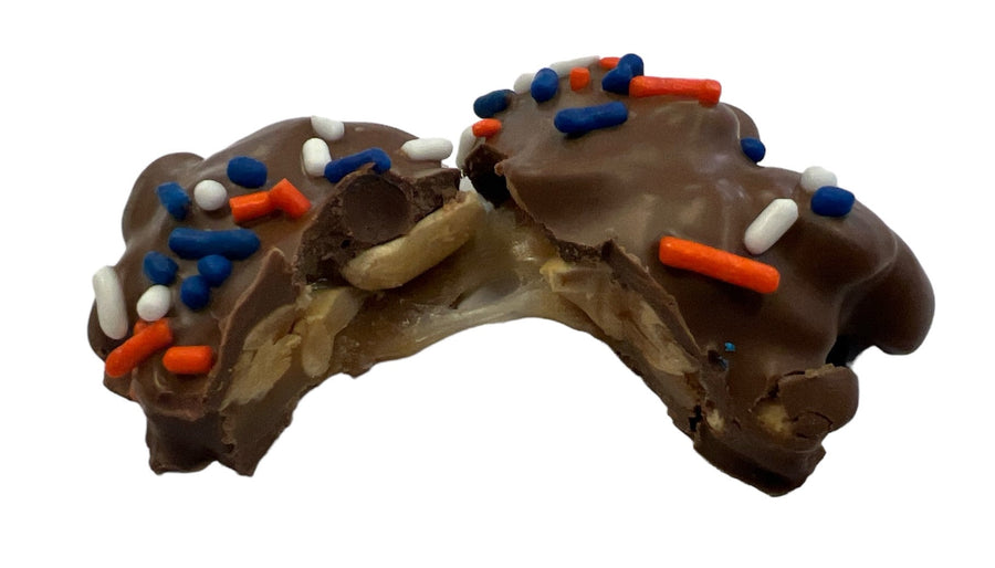 Bronco Bites Chocolate Caramel Peanut Bar — piece cut open to show caramel and peanuts