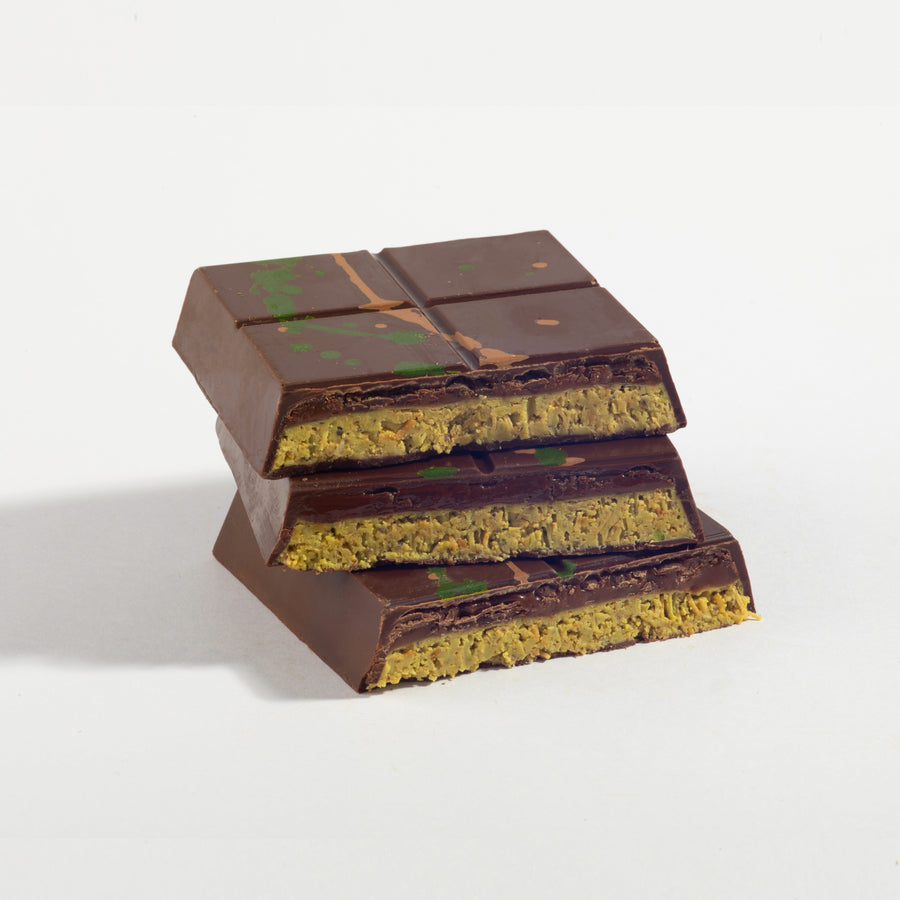 Pistachio Caramel Dubai Chocolate Bar cut open to show its layered filling