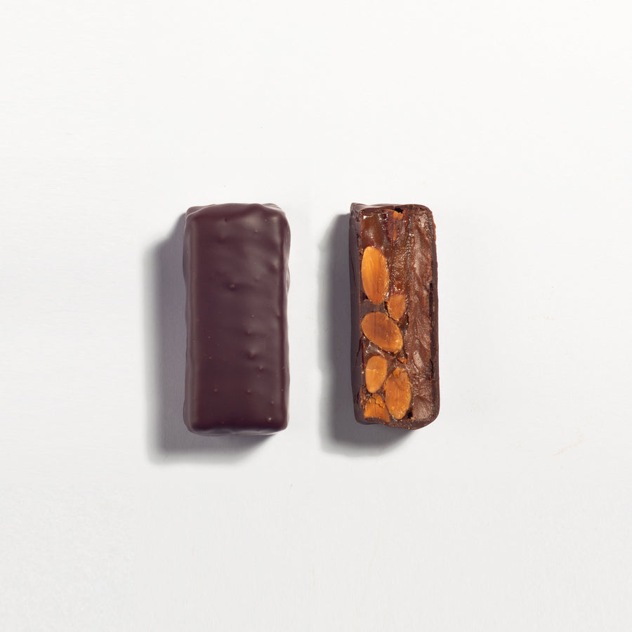 Ode To Joy Almond Caramel & Chocolate Ganache Bar cut open to show the filling