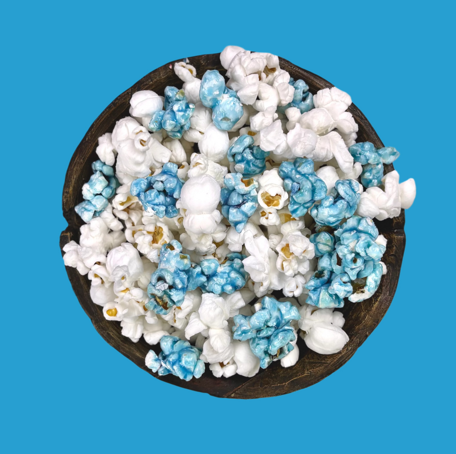 Bowl of light blue candy-coated and white salted popcorn