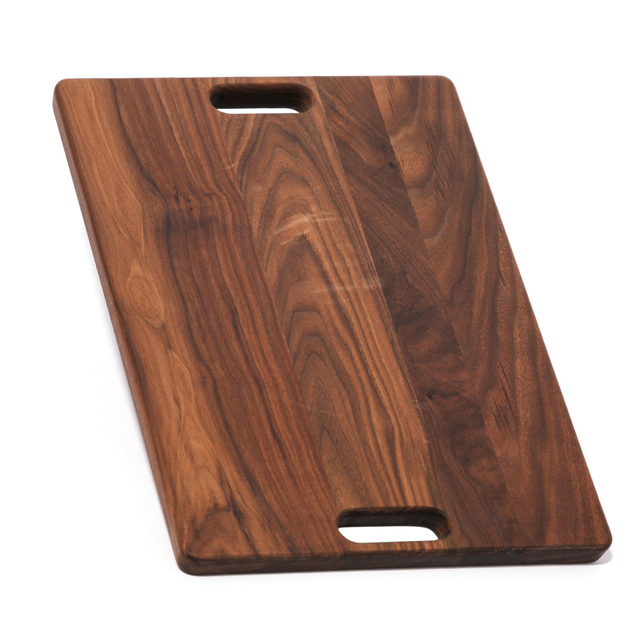 Walnut rectangular board with two cutout handles shown upright