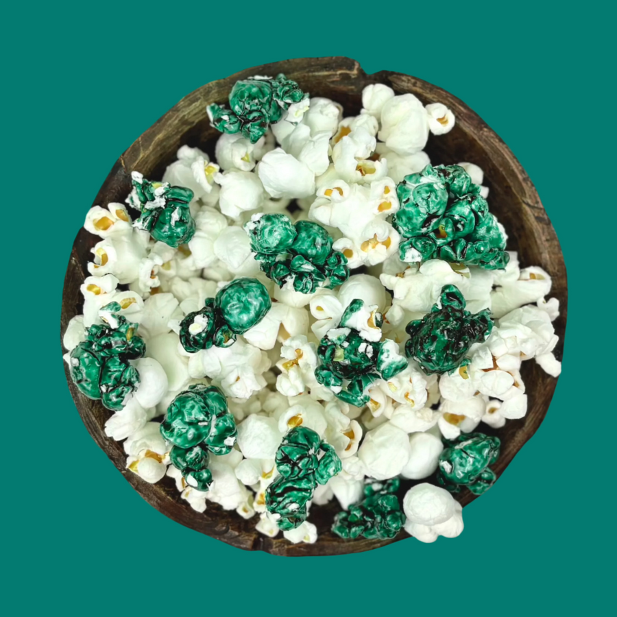 Bowl of teal candy-coated and white salted popcorn