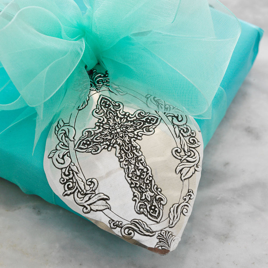 Styled display featuring Faithful Moments Cross Ornament