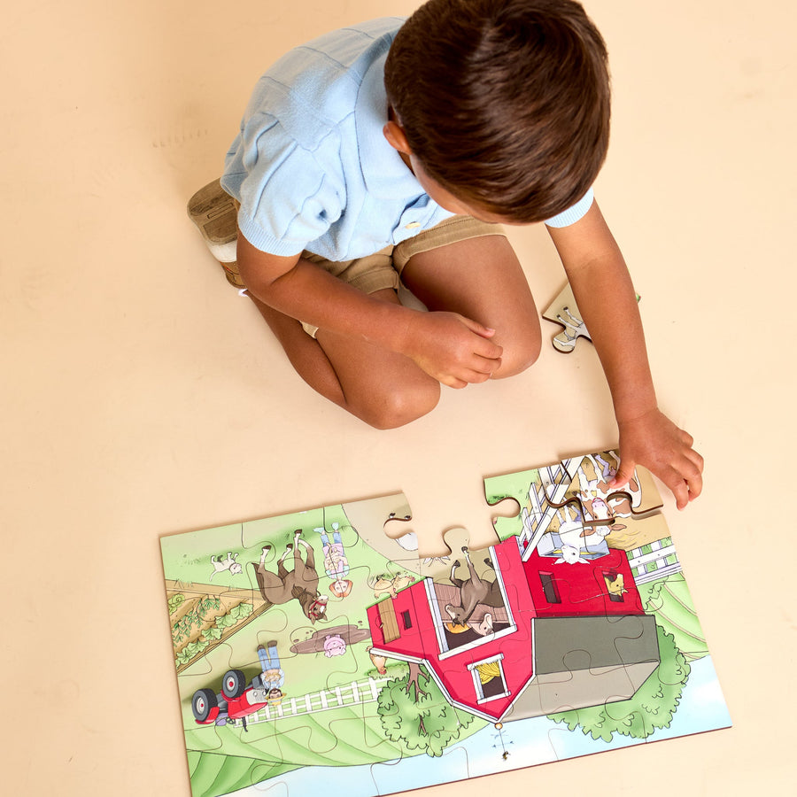 Child fitting illustrated pieces into a wooden-style jigsaw puzzle