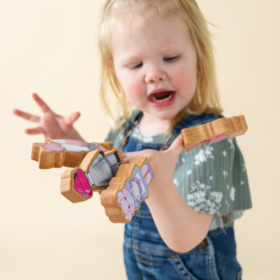 Children using wooden finger puppet characters for storytelling