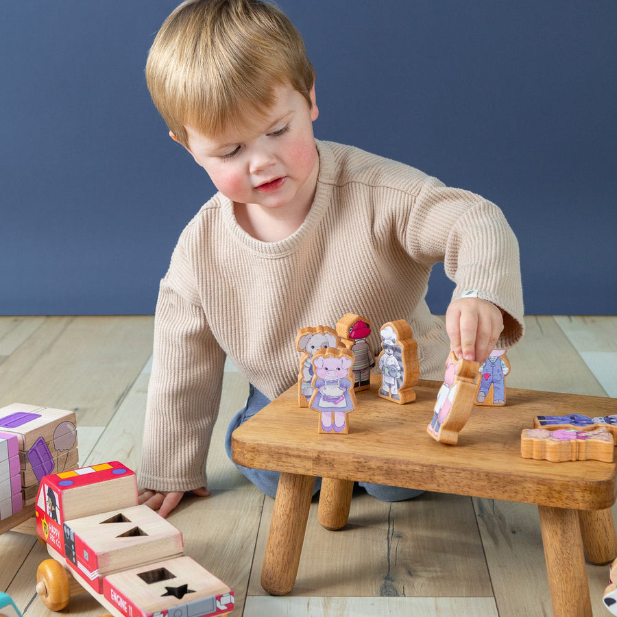 Children using wooden finger puppet characters for storytelling