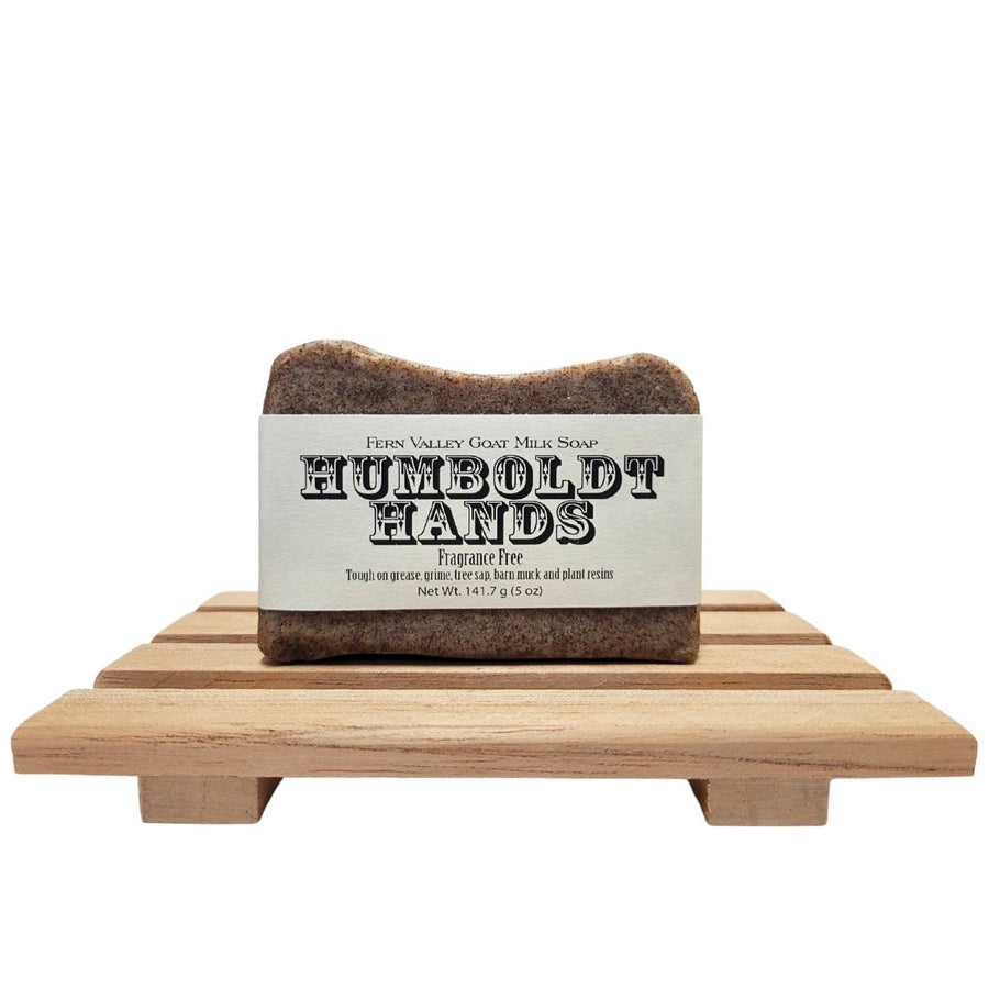 Humboldt Hands Fragrance-Free goat milk soap — bar on a wooden draining soap dish