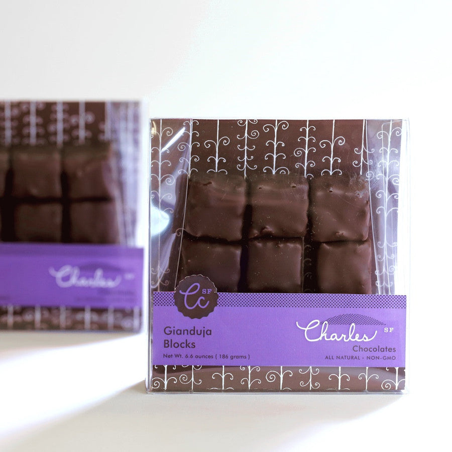 Two labeled packages of Gianduja hazelnut praline chocolate blocks