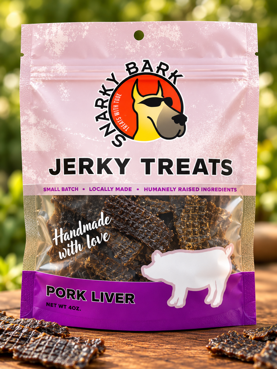 Snarky Bark pork liver jerky treats in a pink pouch with a pig silhouette