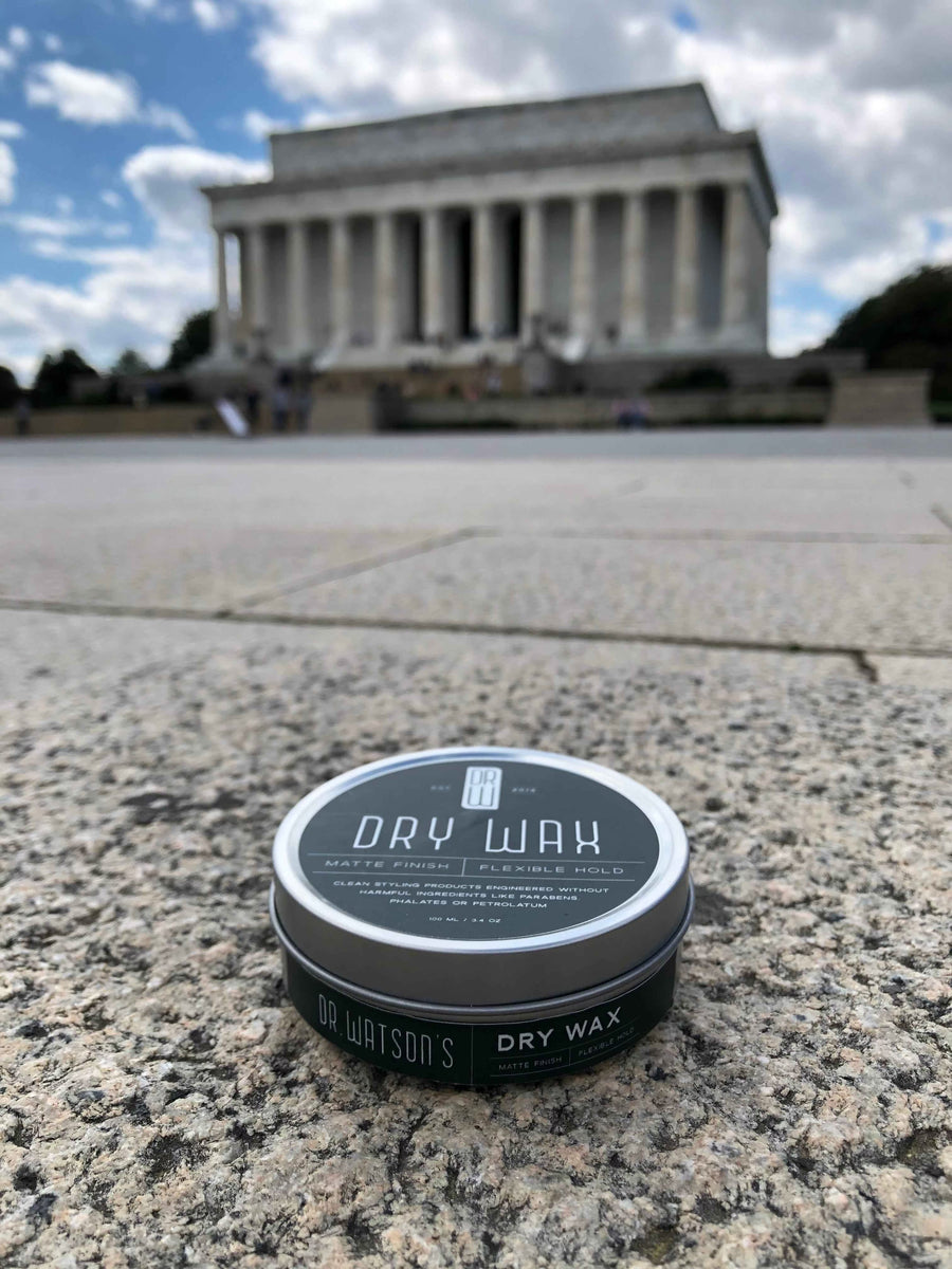 Dry Wax jar on stone paving in front of a columned monument