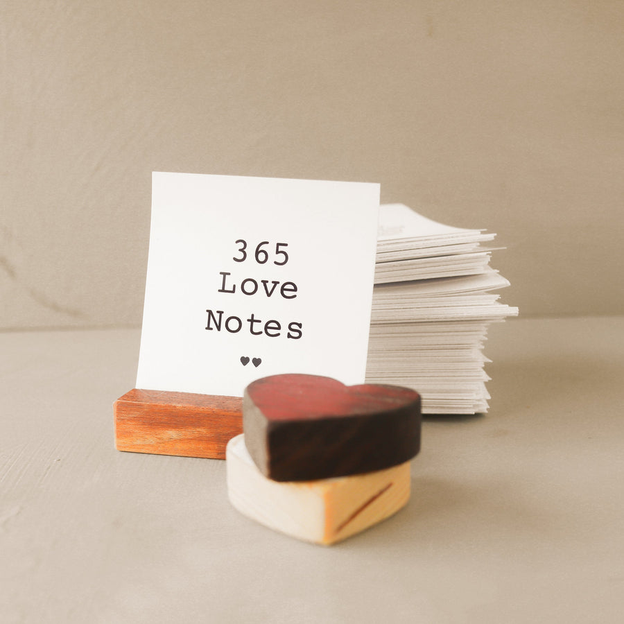365 Love Notes cards with a wooden display stand and small wooden hearts.