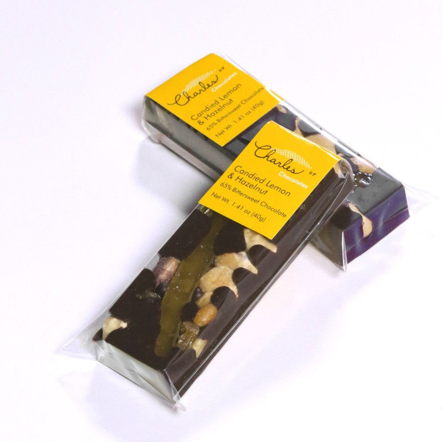 Bittersweet lemon and hazelnut mendiant bar with opened packaging