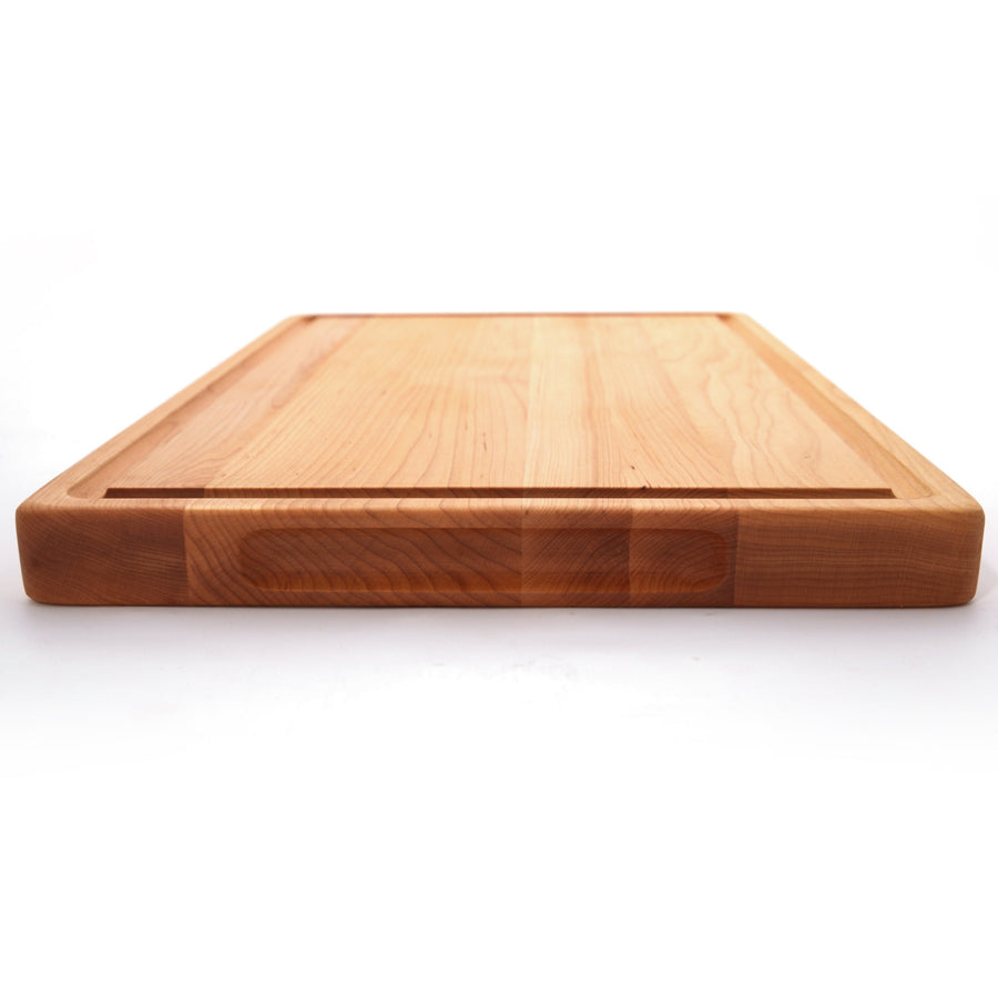 Low side view of a thick maple cutting board with a perimeter groove
