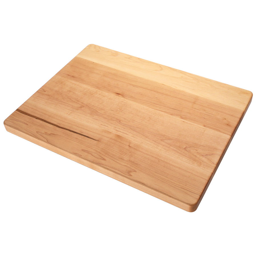 Thick maple cutting board photographed at an angle