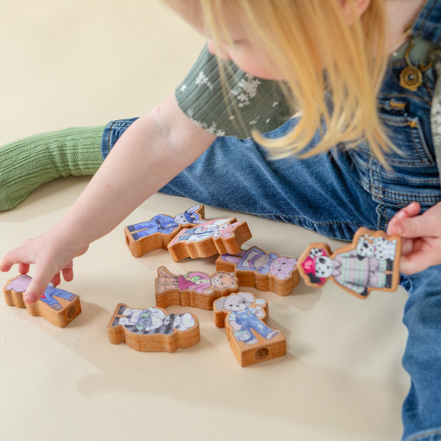 Children using wooden finger puppet characters for storytelling
