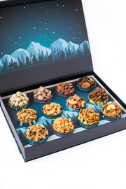 12 Days of Gourmet Nuts Winter Wonderland Selection displayed in an elegant box with mountainous snowy background