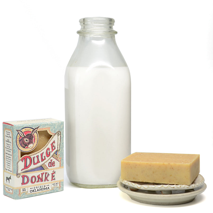 Oat and honey soap with its package and a milk bottle