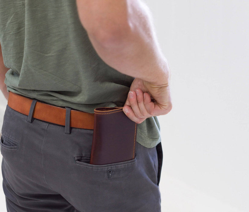 Field Notes Wallet being pulled from the back right pocket of a males pants