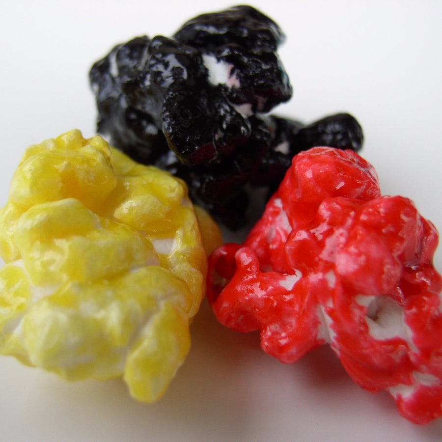 Black, yellow and red candy-coated popcorn