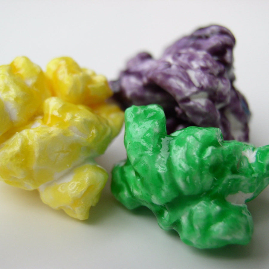 Yellow, purple and green candy-coated popcorn
