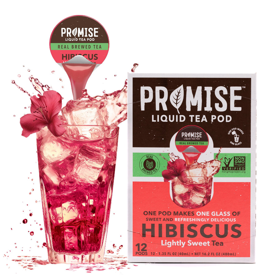 Promise Hibiscus tea carton and pod beside a red iced drink